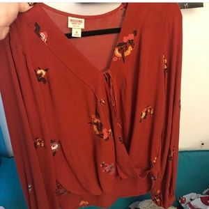 Burnt orange top with flowers